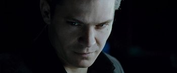 Movie still from “Live Free or Die Hard” (2007), directed by Len Wiseman – A person with a serious look on his face; Close Up shot, Low angle