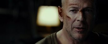 Movie still from “Live Free or Die Hard” (2007), directed by Len Wiseman – A man with a scar on his face; Close Up shot, Low angle