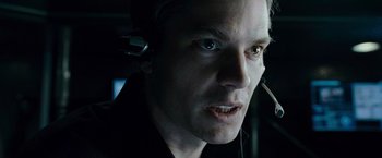 Movie still from “Live Free or Die Hard” (2007), directed by Len Wiseman – A person wearing a headset; Close Up shot, Over the shoulder angle