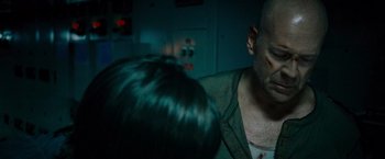 Movie still from “Live Free or Die Hard” (2007), directed by Len Wiseman – A person with a head wound; Close Up shot, Over the shoulder angle
