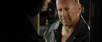 Movie still from “Live Free or Die Hard” (2007), directed by Len Wiseman – A person with a nose ring; Close Up shot, Over the shoulder angle