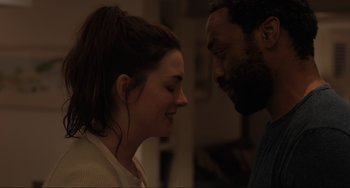 Movie still from “Locked Down” (2021), directed by Doug Liman – A man and a woman looking at one another; Close Up shot, Over the shoulder angle