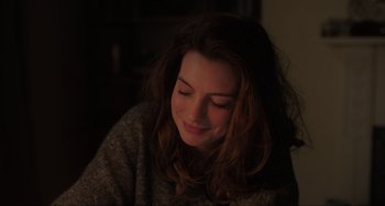 Movie still from “Locked Down” (2021), directed by Doug Liman – A person with long brown hair; Close Up shot, Over the shoulder angle