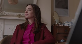 Movie still from “Locked Down” (2021), directed by Doug Liman – A woman in a pink shirt and a red jacket; Medium shot, Over the shoulder angle