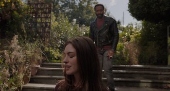 Movie still from “Locked Down” (2021), directed by Doug Liman – A man and a woman standing on some steps; Close Up shot, Over the shoulder angle