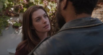 Movie still from “Locked Down” (2021), directed by Doug Liman – A man and a woman standing next to each other in front of a tree; Close Up shot, Over the shoulder angle