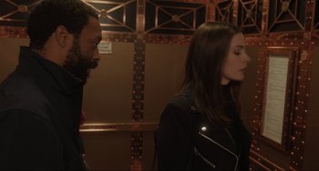 Movie still from “Locked Down” (2021), directed by Doug Liman – A man and a woman standing next to each other; Close Up shot, Over the shoulder angle