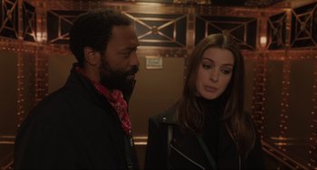 Movie still from “Locked Down” (2021), directed by Doug Liman – A man and a woman standing next to each other; Close Up shot, Over the shoulder angle