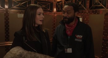 Movie still from “Locked Down” (2021), directed by Doug Liman – A man and a woman standing next to each other; Medium shot, Over the shoulder angle