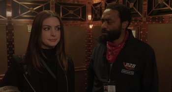 Movie still from “Locked Down” (2021), directed by Doug Liman – A man and a woman standing next to each other; Close Up shot, Over the shoulder angle