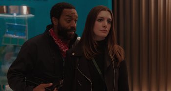 Movie still from “Locked Down” (2021), directed by Doug Liman – A man and a woman standing next to each other; Close Up shot, Over the shoulder angle