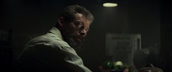 Movie still from “Logan” (2017), directed by James Mangold – A person sitting in a room; Close Up shot, Low angle