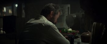 Movie still from “Logan” (2017), directed by James Mangold – A man sitting at a table with a bowl of vegetables; Close Up shot, Over the shoulder angle