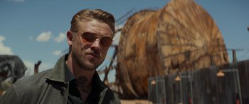 Movie still from “Logan” (2017), directed by James Mangold – A person wearing sunglasses; Close Up shot, Over the shoulder angle