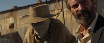 Movie still from “Logan” (2017), directed by James Mangold – A man with a hat and a bandage on his face; Close Up shot, Low angle