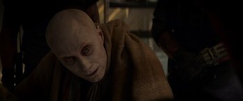 Movie still from “Logan” (2017), directed by James Mangold – A person with a bald head; Close Up shot, Over the shoulder angle