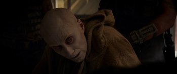 Movie still from “Logan” (2017), directed by James Mangold – A person with a bald head; Close Up shot, Over the shoulder angle