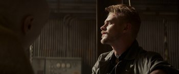 Movie still from “Logan” (2017), directed by James Mangold – A person with a beard looking up; Close Up shot, Low angle