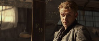 Movie still from “Logan” (2017), directed by James Mangold – A person wearing a tie; Close Up shot, Over the shoulder angle