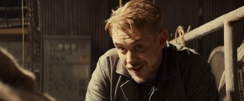 Movie still from “Logan” (2017), directed by James Mangold – A person with blond hair; Close Up shot, Over the shoulder angle