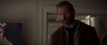 Movie still from “Logan” (2017), directed by James Mangold – A person with a beard looking at the camera; Close Up shot, Low angle