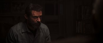 Movie still from “Logan” (2017), directed by James Mangold – A man with a goatee is looking into the distance; Close Up shot, Low angle
