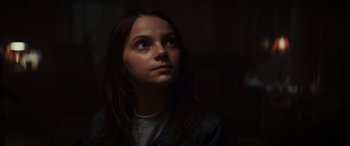Movie still from “Logan” (2017), directed by James Mangold – A young girl looking up into the dark; Close Up shot, Low angle