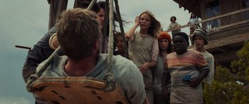 Movie still from “Logan” (2017), directed by James Mangold – A group of people standing on top of a boat; Medium shot, Low angle