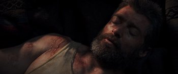 Movie still from “Logan” (2017), directed by James Mangold – A person laying on the ground; Close Up shot, Overhead angle
