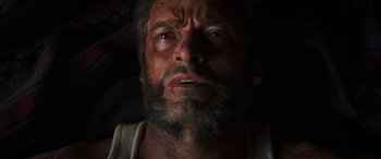 Movie still from “Logan” (2017), directed by James Mangold – A person with a beard looking at the camera; Close Up shot, Overhead angle
