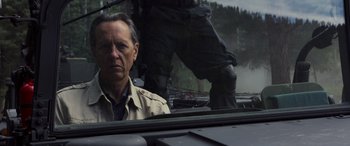 Movie still from “Logan” (2017), directed by James Mangold – A man sitting in the back of a truck looking out the window; Close Up shot, Over the shoulder angle