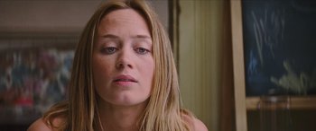 Movie still from “Looper” (2012), directed by Rian Johnson – A person with long hair; Close Up shot, Low angle