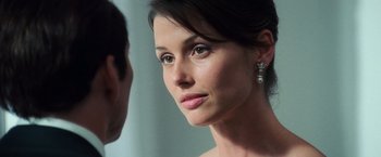 Movie still from “Lord of War” (2005), directed by Andrew Niccol – A woman's face and a man; Close Up shot, Over the shoulder angle