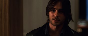 Movie still from “Lord of War” (2005), directed by Andrew Niccol – A person with long hair; Close Up shot, Over the shoulder angle