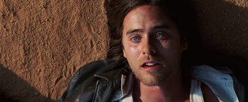 Movie still from “Lord of War” (2005), directed by Andrew Niccol – A person wearing a leather jacket; Close Up shot, Overhead angle