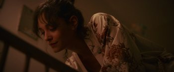 Movie still from “Lost Bullet 2: Back for More” (2022), directed by Guillaume Pierret – A person wearing a robe; Close Up shot, High angle