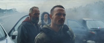 Movie still from “Lost Bullet 2: Back for More” (2022), directed by Guillaume Pierret – A group of men standing next to each other; Medium shot, Low angle