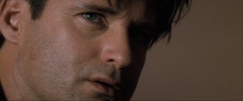 Movie still from “Lost Highway” (1997), directed by David Lynch – A person's face with blue eyes; Extreme Close Up shot, Low angle