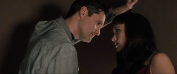 Movie still from “Lost Highway” (1997), directed by David Lynch – A man and a woman face to face in front of a mirror; Close Up shot, Low angle