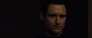 Movie still from “Lost Highway” (1997), directed by David Lynch – A person with his eyes wide open; Close Up shot, Low angle