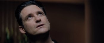 Movie still from “Lost Highway” (1997), directed by David Lynch – A person looking up at the sky; Close Up shot, Low angle