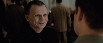 Movie still from “Lost Highway” (1997), directed by David Lynch – A person smiling; Close Up shot, Over the shoulder angle