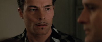 Movie still from “Lost Highway” (1997), directed by David Lynch – A person with a mustache; Close Up shot, High angle