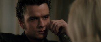 Movie still from “Lost Highway” (1997), directed by David Lynch – A person holding a cell phone to his ear; Close Up shot, Low angle