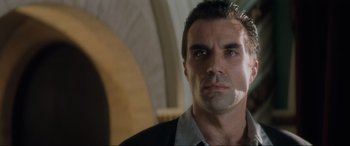 Movie still from “Lost Highway” (1997), directed by David Lynch – A person wearing a suit and tie; Close Up shot, Low angle