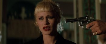 Movie still from “Lost Highway” (1997), directed by David Lynch – A woman with blonde hair is getting her hair combed; Close Up shot, Over the shoulder angle