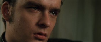 Movie still from “Lost Highway” (1997), directed by David Lynch – A young man's eyes and face; Close Up shot, Low angle