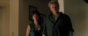 Movie still from “Lost Highway” (1997), directed by David Lynch – A man and a woman standing next to each other in a room; Medium shot, Low angle