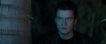 Movie still from “Lost Highway” (1997), directed by David Lynch – A person wearing a black shirt; Close Up shot, Low angle