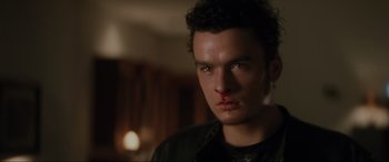 Movie still from “Lost Highway” (1997), directed by David Lynch – A person with a blood spot on his face; Close Up shot, Low angle